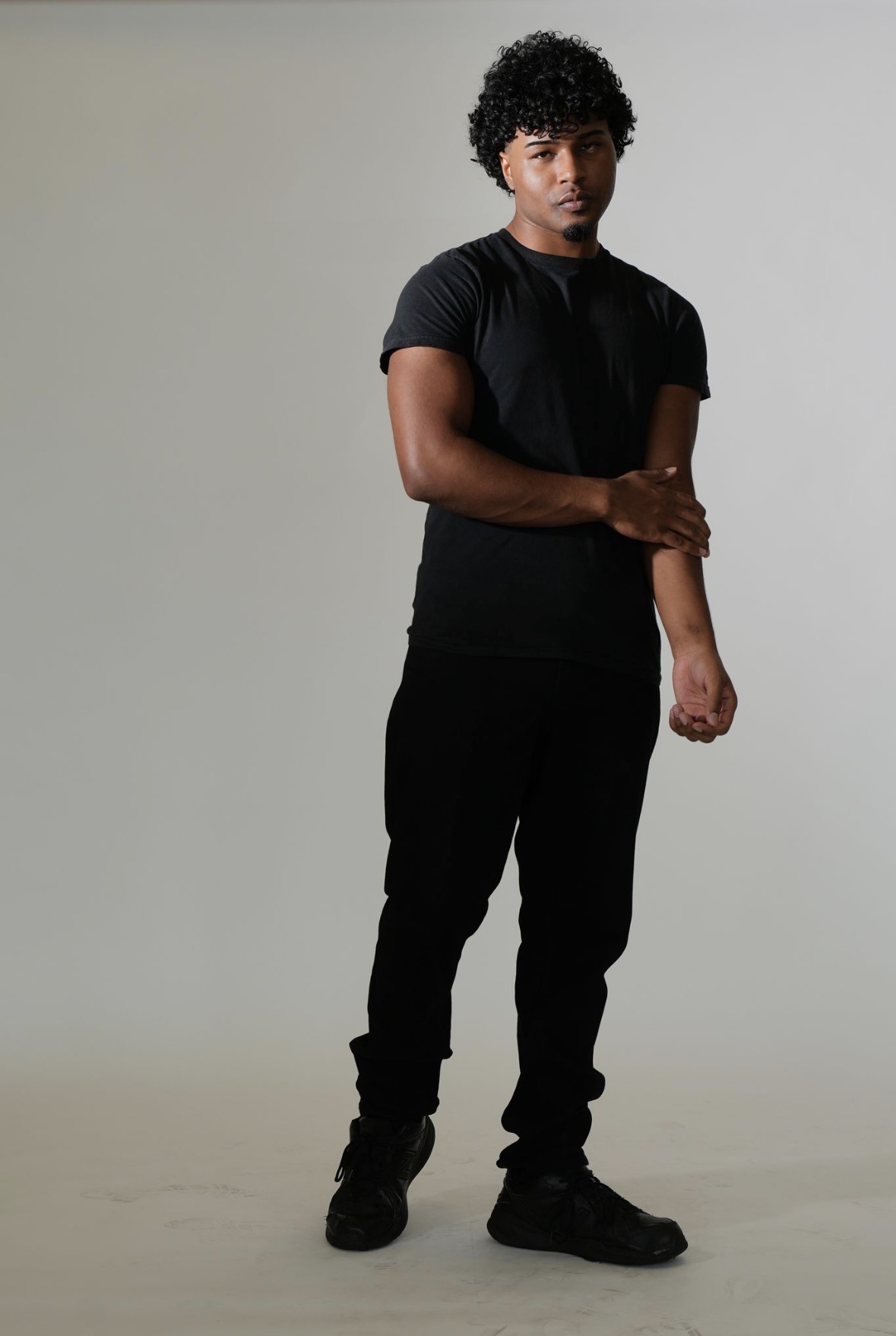 Cole in a relaxed full-length pose